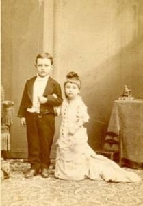 sepia-photo-of-two-children-posing-as-tom-thumb-and-his-wife