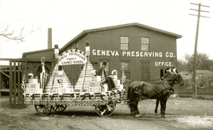 photo-of-a-horse-drawn-wagon-full-of-canned-goods-in-front-of-a-building-labeled-geneva-preserving-office