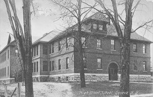 A large brick and stone building with an arched entrance.