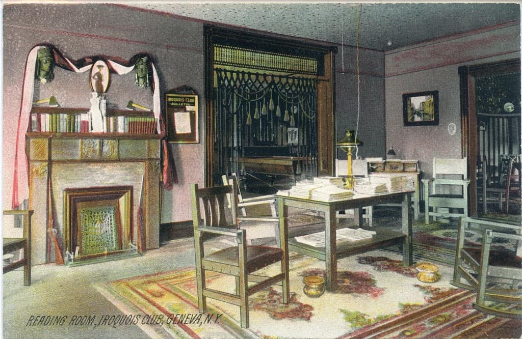 Early-1900s-postcard-of-a-reading-room-with-tables-chairs-and-spitoons