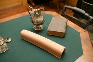 Drain Tile, book, and pitcher on a table