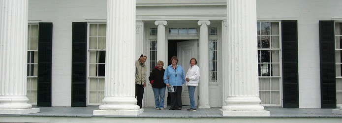 people-on-the-front-porch-of-rose-hill-mansion