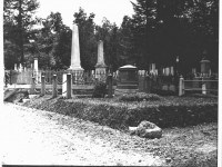 black-and-white-photo-of-several-cemetery-plots-including-swift-monument-in-washington-street-cemetery