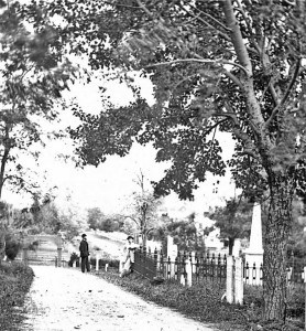 Black and white photo of two men in Washington Street Cemetery