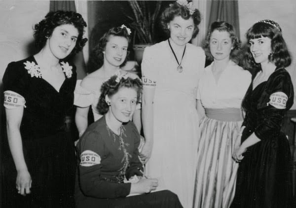 Group of five young women wearing USO armbands