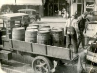 men-on-wagon-full-of-beer-barrels