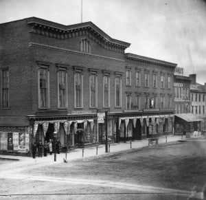 Black and white photo of Linden Hall and three other buildings on Seneca Street