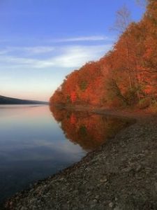 Colored photo of Hemlock Lake in autumn