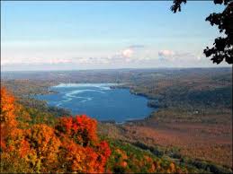 Colored photograph of an aerial view of Honeoye Lake in autumn