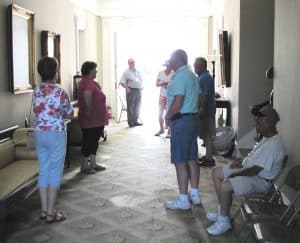 people standing in a hallway