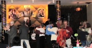 Colored image of people people dancing in the dining room of Club 86.