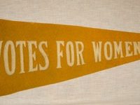 yellow-pennant-banner-with-votes-for-women-in-white-letters