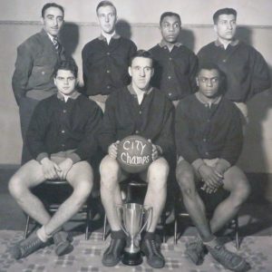 A group of basketball players with their coach