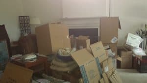 Packed and unpacked boxes in a room