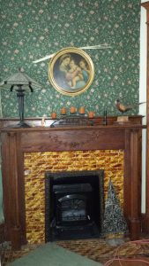 Fireplace with knick knacks on the mantle