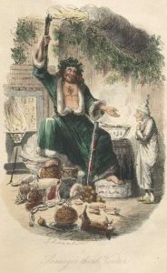 man sitting in front of a fire place surrounded by food and a man standing in front of him.