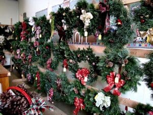 wreaths hanging on wooden racks