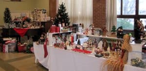 Tables filled with Christmas decorations and ornaments