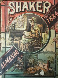 cover to an almanac contains an image of a woman sitting in front of a window reading