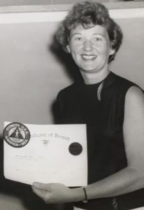 woman holding a certificate