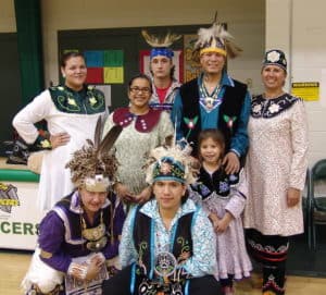 A group of young men and women in traditional Iroquois dress.
