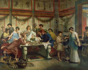 Painting of a group of idealized Roman men, women and children in tunics, feasting at a table of fruit and wine.