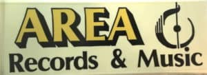 Rectangular sign that hung over the sidewalk from Area Records and Music on Seneca Stree