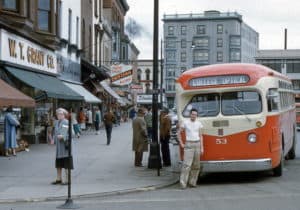 Man In White T Shirt In Front Of Bus May 1954