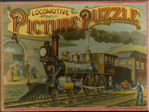 Color illustration of a train arriving at a station labeled "Locomotive Picture Puzzle."