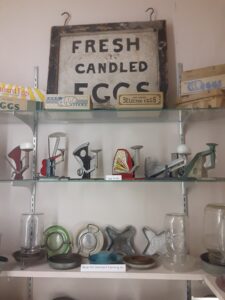 Various poultry paraphernalia displayed on shelves