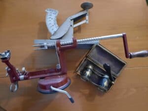 apple peeler, opera glasses, and the scale