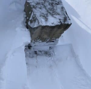 Carriage stone in the snow outside of the Housman home