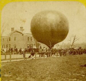 Photo of a balloon inflated at the corner of Genesee and Lewis Streets in May 1874