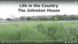 View of green fields and title Life in the Country: The Johnston House
