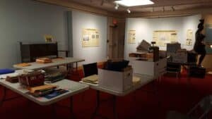 Boxes and materials of the Geneva Woman's Club on tables