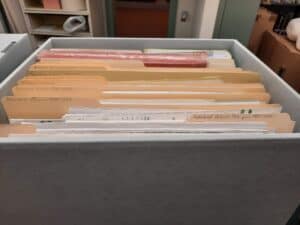 Archival box filled with  folders that  are part of the Geneva Woman's Club Collection