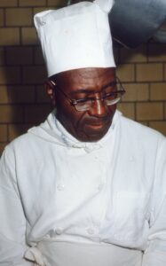 African American Man In Chef Hat And Coat
