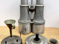 Metal Binoculars And Two Small Oil Lamps