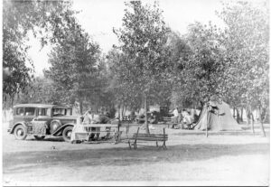 ca. 1930s camping grounds at Seneca Lake Park with cars, benches, and tents