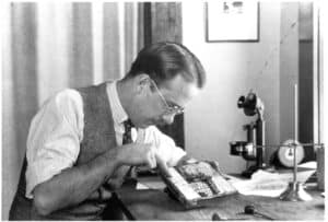 Norman Kent working on a woodcut