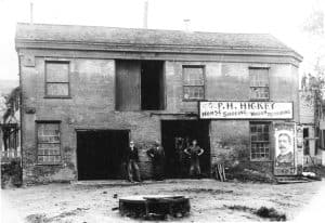 blacksmith shop with three men in front