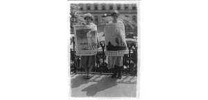 Miss Goldie Dunn and Miss Louise Hiatt, of the National Council for the Prevention of War, holding isolationist posters. 