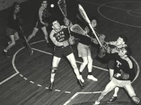 six lacrosse players fight for air ball