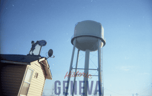 yellow building water tower blue sky