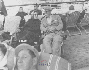 People sitting on a deck of a cruise ship