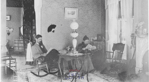 Black and white photo of two people inside the Octagon House