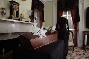 Casket in in front of a fireplace at Rose Hill Mansion