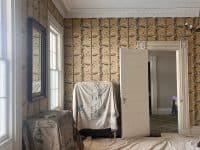 The floor and furniture covered in the Breakfast Room at Rose Hill.