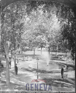 Black and white photo of people around the the fountain in Pulteney Park 
