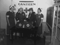 Photo of four members of the Geneva Red Cross Canteen